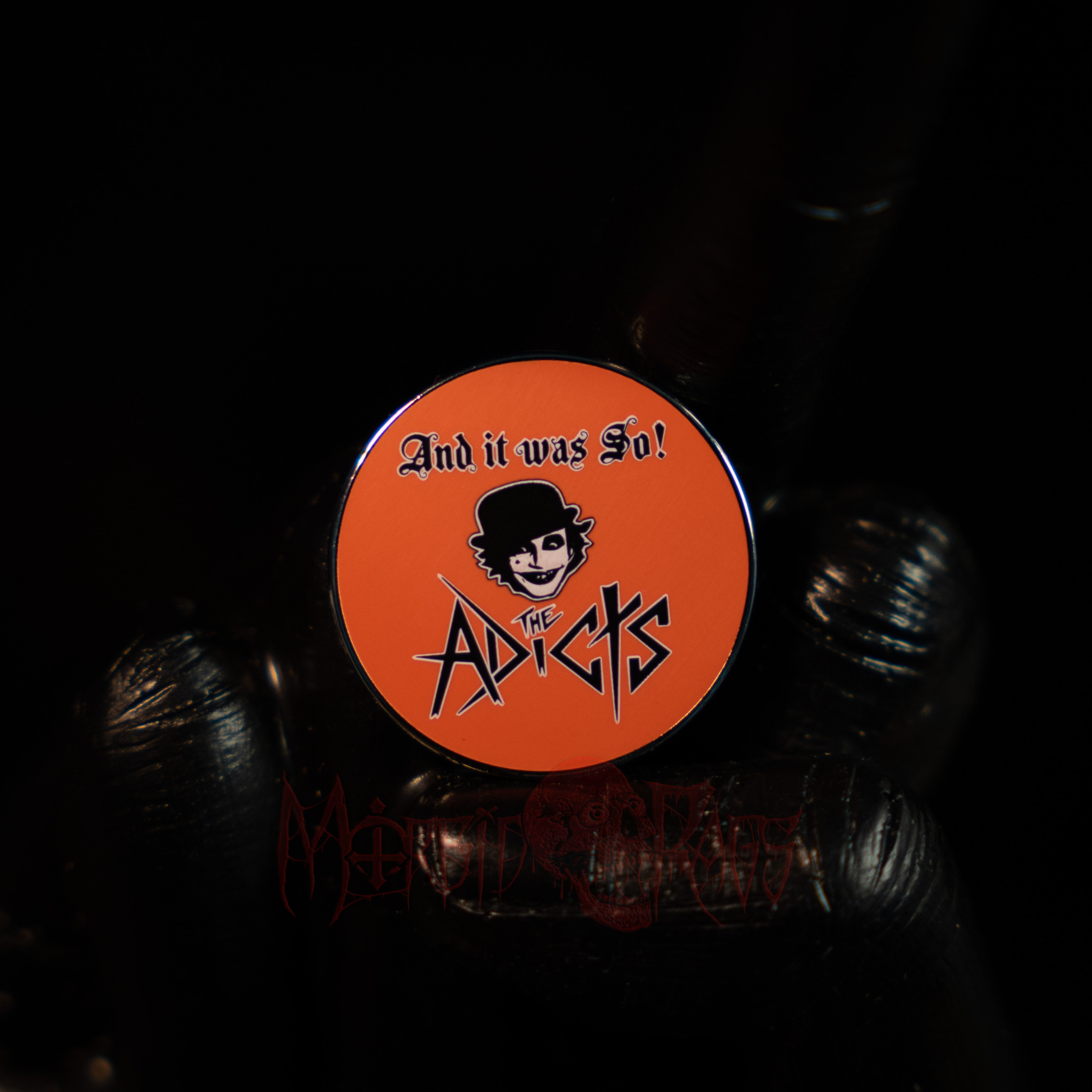 The Adicts Orange Logo Pin Front